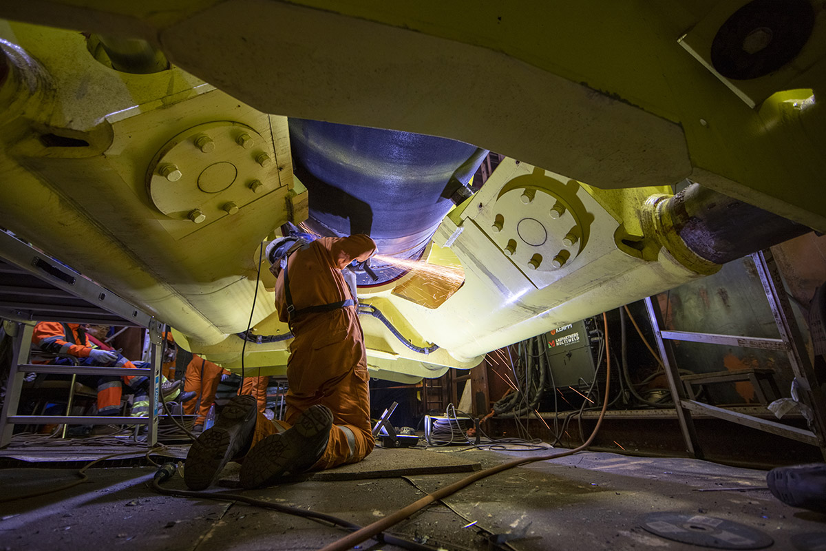 Specialists working on the laybarge Fortuna on finishing construction work